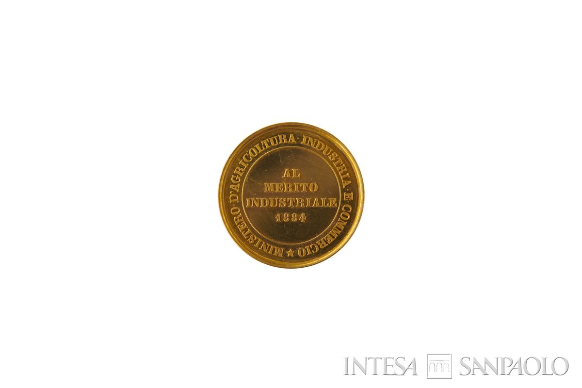 Medaglia d'oro al merito industriale, conferita in seno all'Esposizione di Torino, 1884 (retro)
